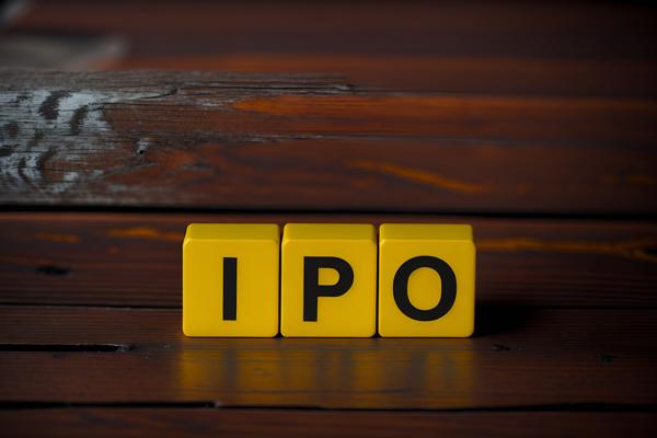 Download image of the word 'IPO' printed in bold letters on a yellow Dice Cube, representing the concept of an initial public offering.-banrupi